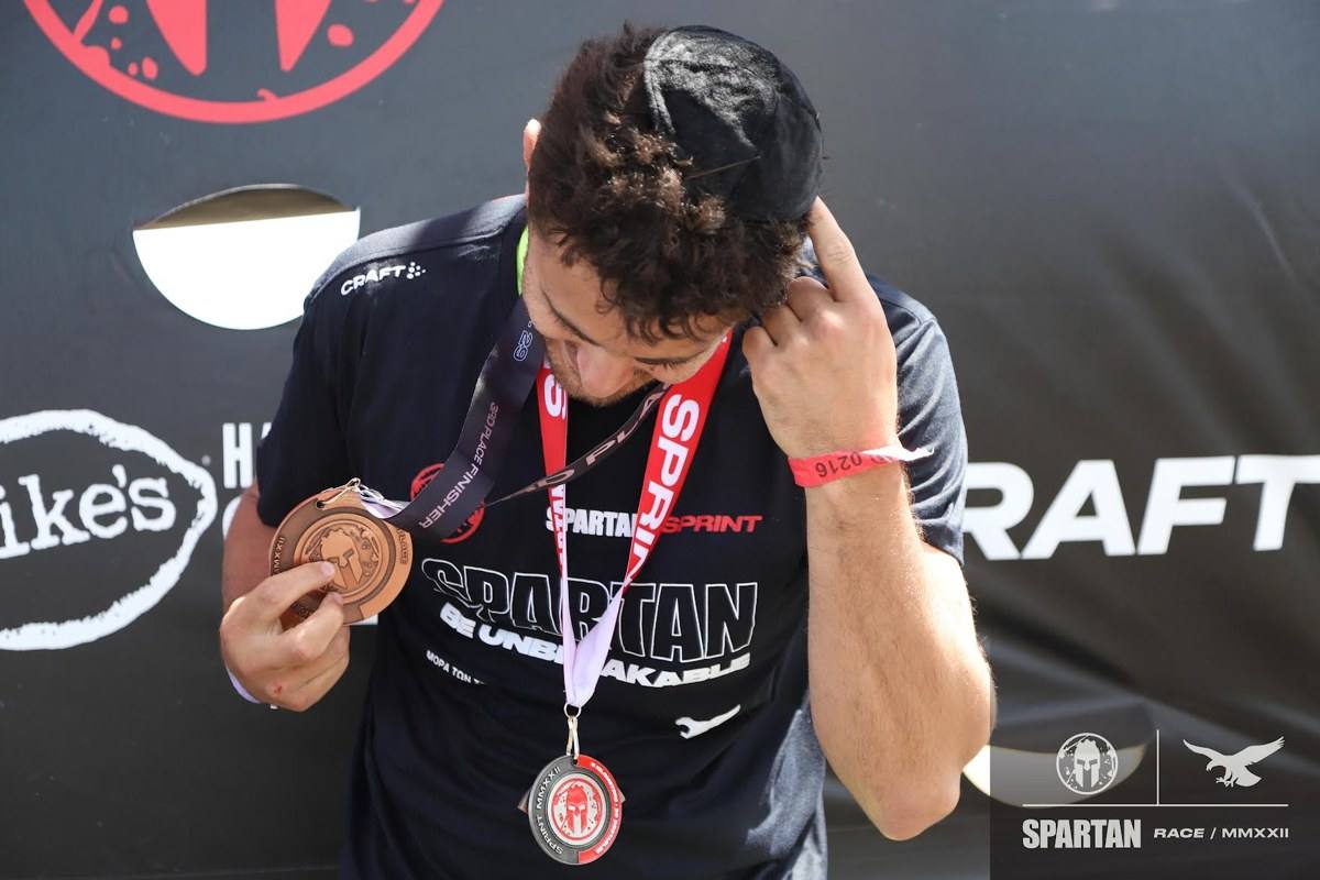 Michael Neuman with a race medal